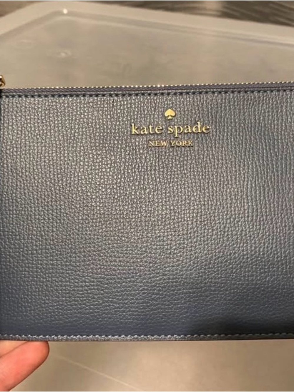 kate spade navy pebbled leather wristlet with gold logo